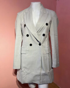 Sophisticated and sleek, this light beige double-breasted blazer dress is perfect for when you want to look sharp and stylish. Featuring a tailored fit, black button accents, and flap pockets, it's ideal for business events, dinner dates, or a polished day-to-night outfit. Dress it up with heels or keep it cool with ankle boots!